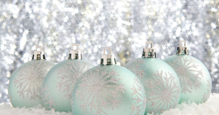 Mint Green Christmas Ball Ornaments against a shiny white background